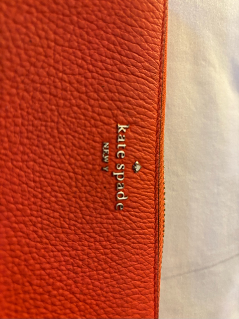 kate spade Orange Pebbled Leather Leila large zip wallet